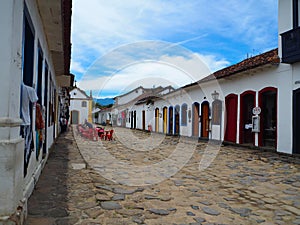 Parati, Brasil - 23 December 2016: Sweet and colorful houses in colonial style with cobblestone floor in Parati, Brasil photo
