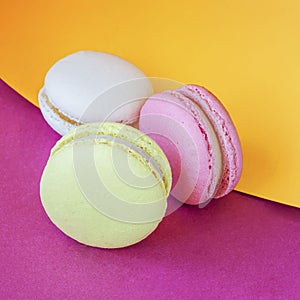 Sweet colorful Macaroons close-up on bright background. French sweet cookie