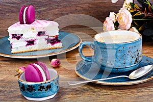 Sweet and Colourful Cake with French Macaroons with Cup of Cofee