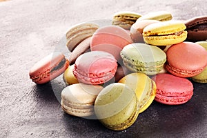 Sweet and colourful french macaroons or macaron on table