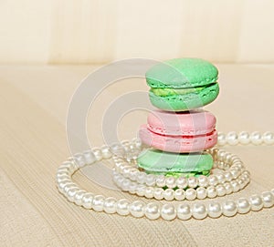 Sweet and colourful french macaroons and pearls