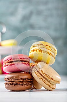 Sweet and colourful french macaroons on retro-vintage background