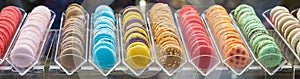 Sweet and colourful french macaroons in a row.