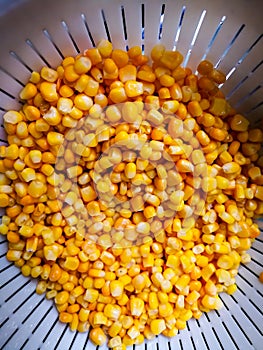 Sweet corn in cullender drained.
