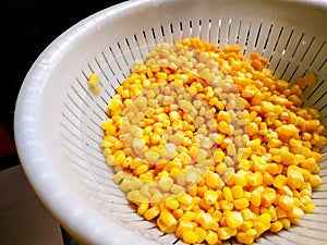 Sweet corn in cullender drained.