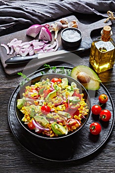 Sweet corn salad with avocado in a bowl