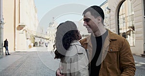 Sweet couple have vacation in old european town. Happy young lovers enjoy time spending together