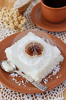 Sweet couscous (tapioca) pudding (cuscuz doce) with coconut