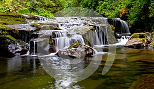 Sweet Creek waterfall drop off with crystal clear water below