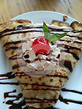Sweet crepe with cholocate and whipped cream
