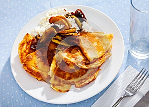 Sweet crepes with cottage cheese and baked apples with cinnamon