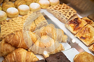 Sweet Croissants and Dessert in Shop Supermarket Bakery