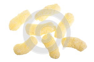 Sweet crunchy corn sticks or snacks on white background. Top view. Flat lay