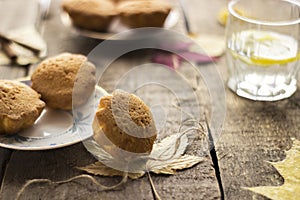 Sweet cupcakes on old wooden background