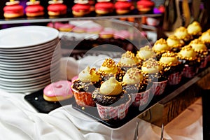 Sweet cupcakes with toppings at the hotel buffet