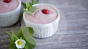 sweet curd mass whipped with fresh strawberries in a bowl