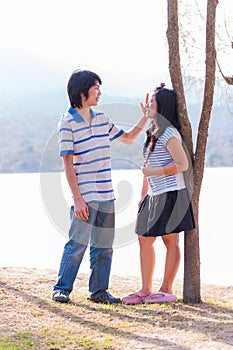 Sweet Cute Couple Relaxing in Park