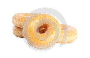 Sweet delicious glazed donuts on background