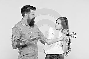 Sweet dessert. Bearded hipster good daddy for adorable daughter. Sharing sweets with dearest people. Daughter and father photo
