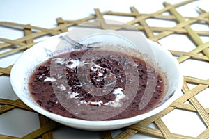 Sweet dessert in Malaysia and Indonesia, call bubur pulut hitam on white plate