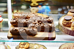 Sweet desserts and cakes in a vitrine of a cafe