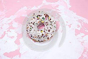 Sweet donut on a white and pink background