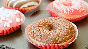 Sweet donuts on the black background