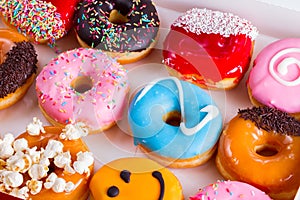 Sweet doughnuts on gray stone background