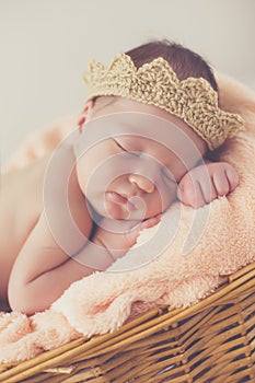 Sweet dream newborn baby in a big basket