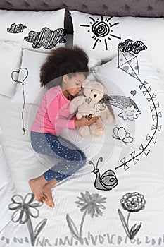 Sweet dreams. African American girl sleeping, above view. Sun, kite and other illustrations on foreground