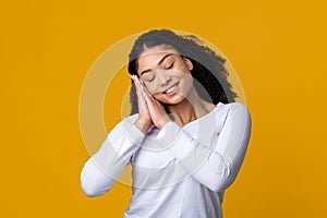 Sweet Dreams. Beautiful calm african american lady with serene face pretending sleeping