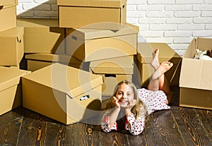 Sweet dreams. happy child cardboard box. happy little girl with toy. purchase of new habitation. playing into new home