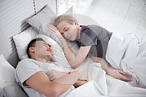 Peaceful gay couple sleeping