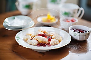 sweet dumplings with fruit filling and a dusting of sugar