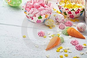 Sweet Easter concept. Sweet Easter kids holiday assortment marshmallows rabbit, chocolates easter eggs, candies, bunny, snacks on