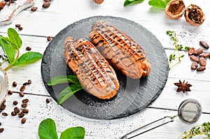 Sweet eclair cake with chocolate. Baking. Top view,