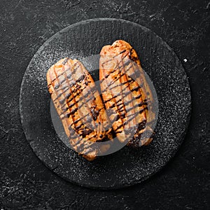 Sweet eclair cake with chocolate. Baking. Top view