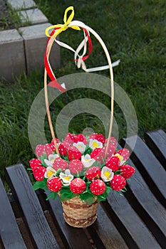 Sweet edible bouquet of sweets in the form of strawberries. Handmade. Gift for St. Valentine`s Day photo