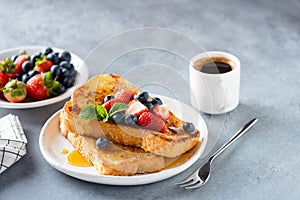 Sweet french challah toast with berries and syrup