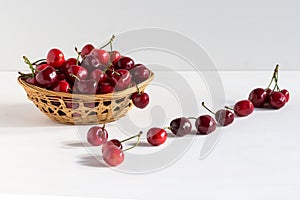 Sweet fresh cherries in a bowl isolated on white backdrop, fruit backround. Healthy food, top view