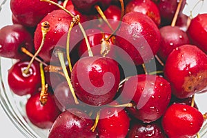 Sweet fresh red cherries in glassware. Summer lifestyle shot. photo