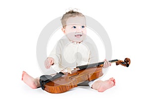 Sweet funny baby playing violin