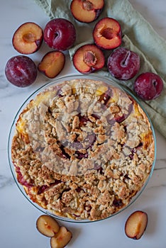 Sweet German plum cake Zwetschgenkuchen with crumbles