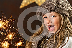 Sweet girl having fun with fireworks.