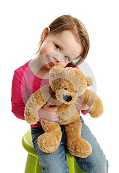 Sweet girl holding a teddy bear
