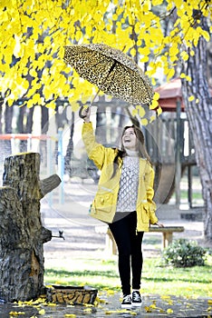 Sweet girl jumping with umbrella