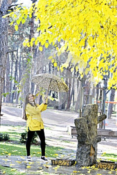 Sweet girl jumping with umbrella