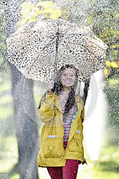 Sweet girl jumping with umbrella