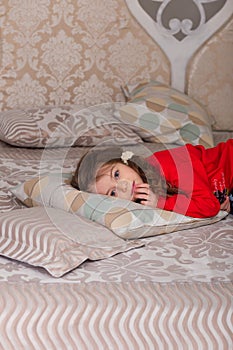 Sweet girl in pajamas getting ready for bed