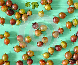 sweet goosberries, layed out as pattern on green background, flat lay, food concept, free copy space